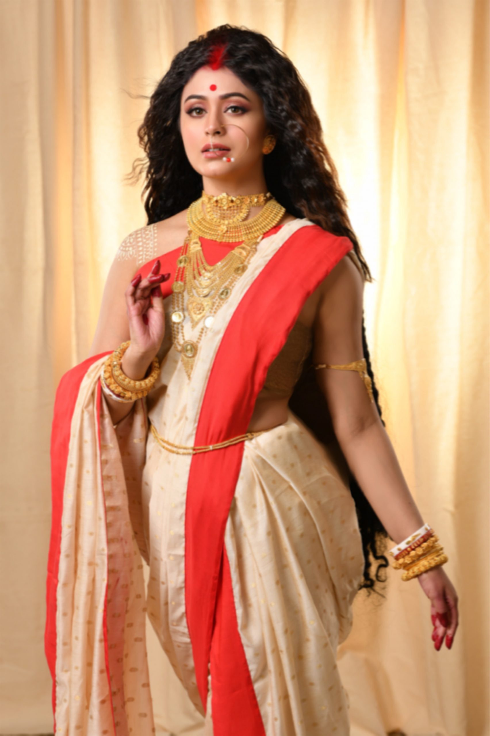 Kalyan Jewellers' Brand Ambassador Ritabhari Chakraborty in the avatar of Goddess Sati wearing jewellery from Muhurat 