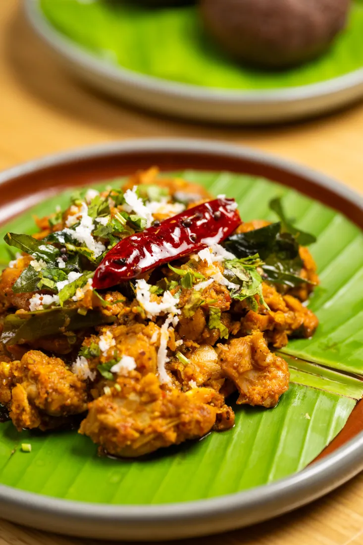 Karnataka-style chicken on a banana leaf at The Hebbal Cafe, Courtyard by Marriott Bengaluru Hebbal