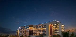 Grand Hyatt Kochi Bolgatty lit up at dusk on Bolgatty Island, Kochi