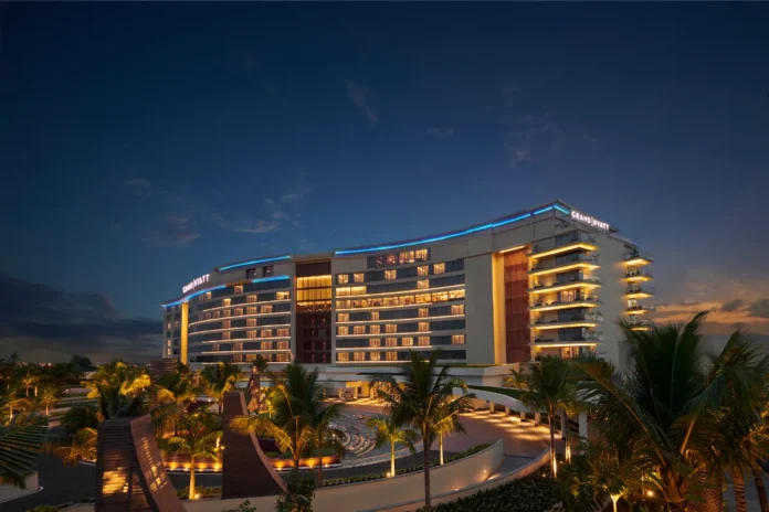 Grand Hyatt Kochi Bolgatty lit up at dusk on Bolgatty Island, Kochi