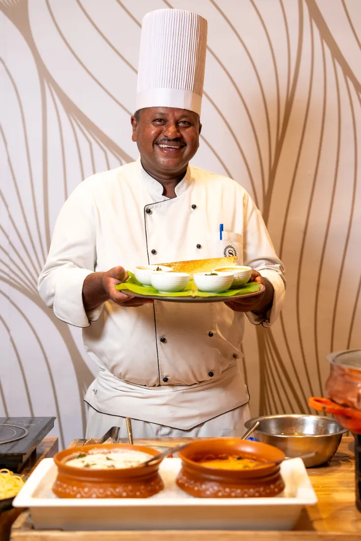 Chef with Karnataka dishes for the Rajyotsava lunch at Sheraton Grand Bangalore