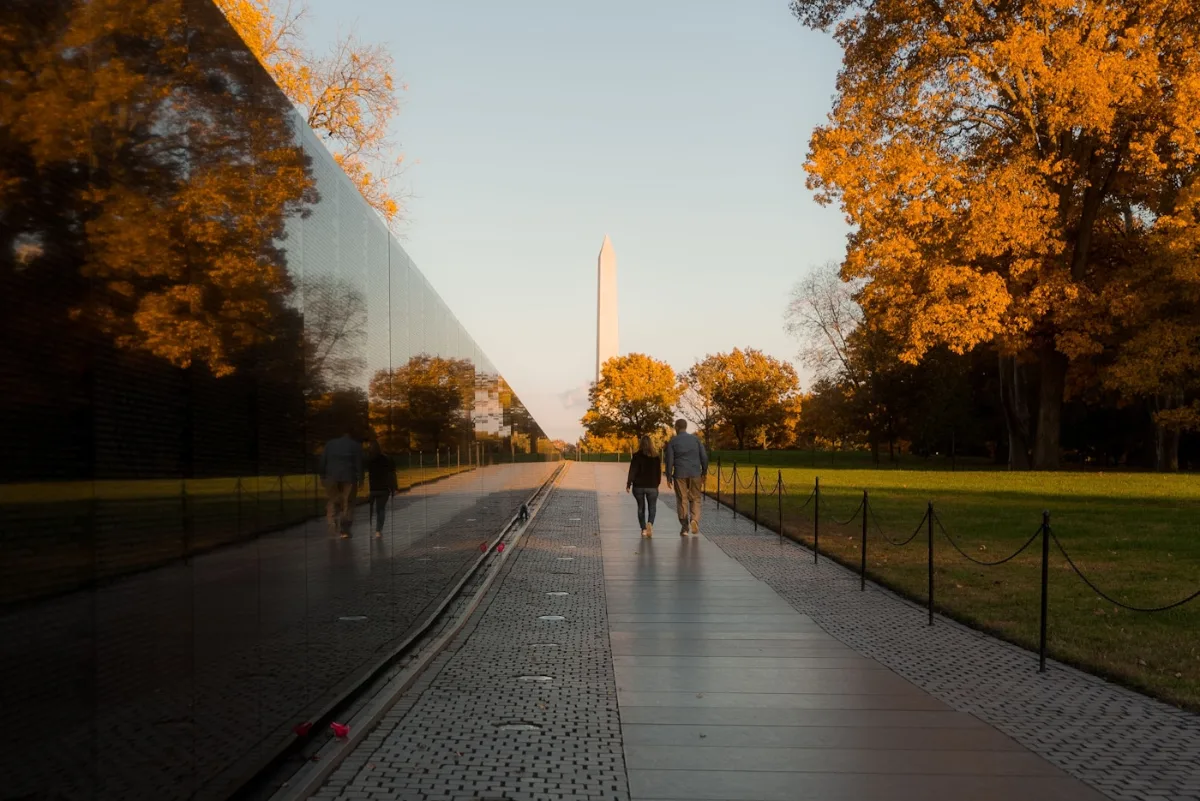 Autumn trees along the Vietnam Veterans Memorial with the Washington Monument behind, Washington, DC