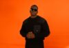 THG India Signs YUNG SAMMY, ARMA and Sixth Ocean to Exclusive Global Management Rapper YUNG SAMMY against an orange backdrop