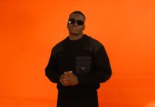THG India Signs YUNG SAMMY, ARMA and Sixth Ocean to Exclusive Global Management Rapper YUNG SAMMY against an orange backdrop