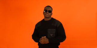 Rapper YUNG SAMMY against an orange backdrop