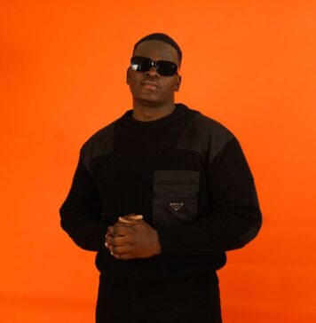 Rapper YUNG SAMMY against an orange backdrop