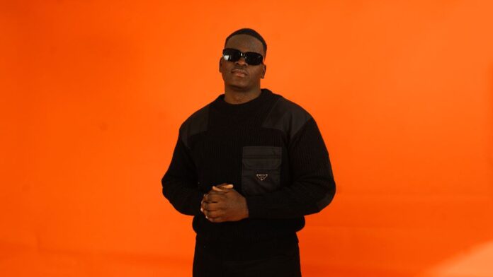 yung-sammy-thg-india Rapper YUNG SAMMY against an orange backdrop